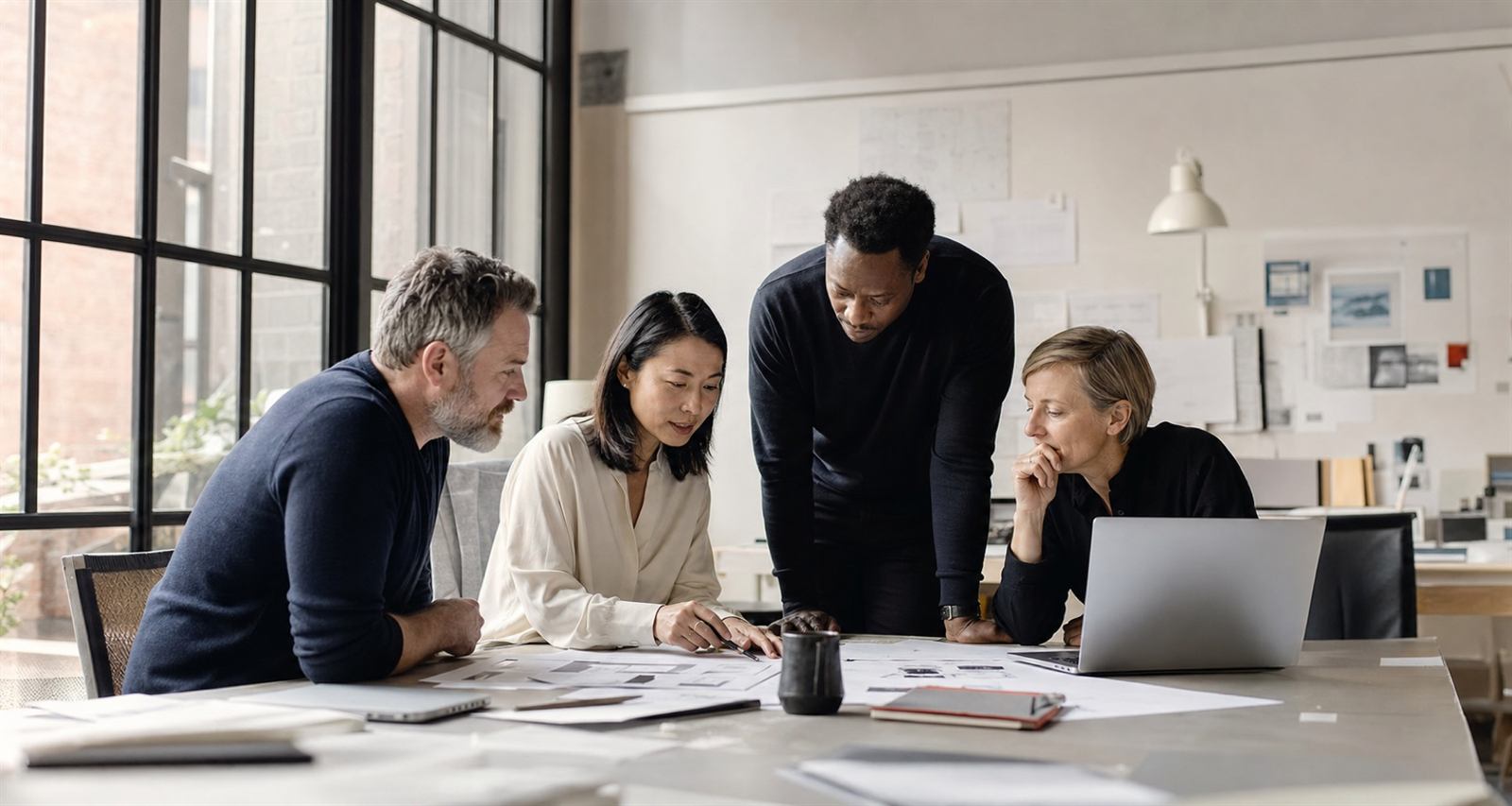 Software engineering team collaborating in a modern studio
